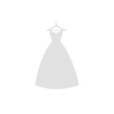 Сouple wearing a white gown and a black suit on the grass