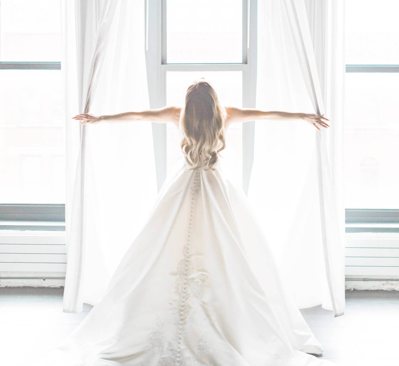 Photo of a model in a long white gown