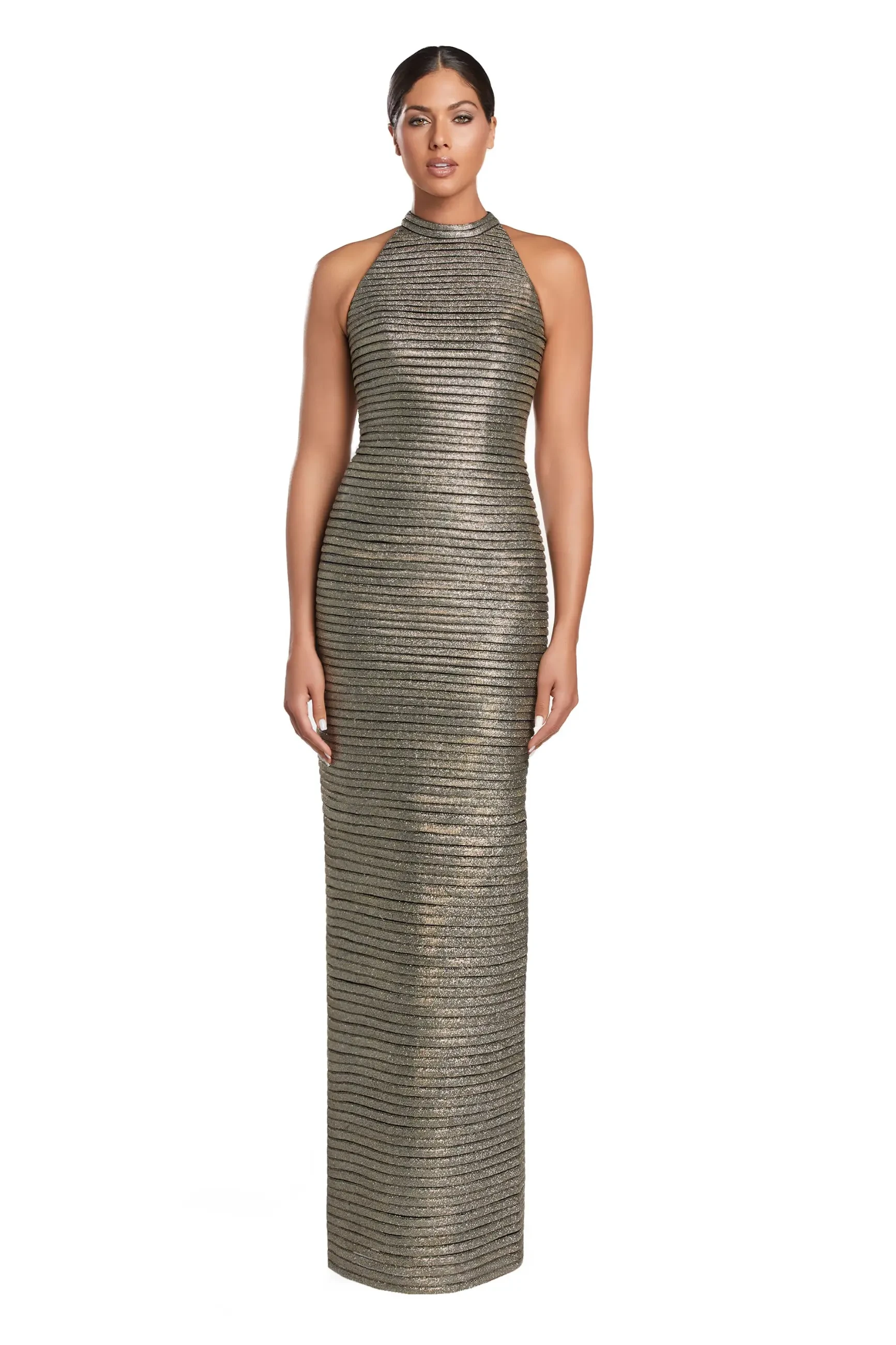 A woman in a metallic gold, sleeveless, high-neck gown stands confidently. The dress features horizontal stripes and exudes an elegant, formal tone.