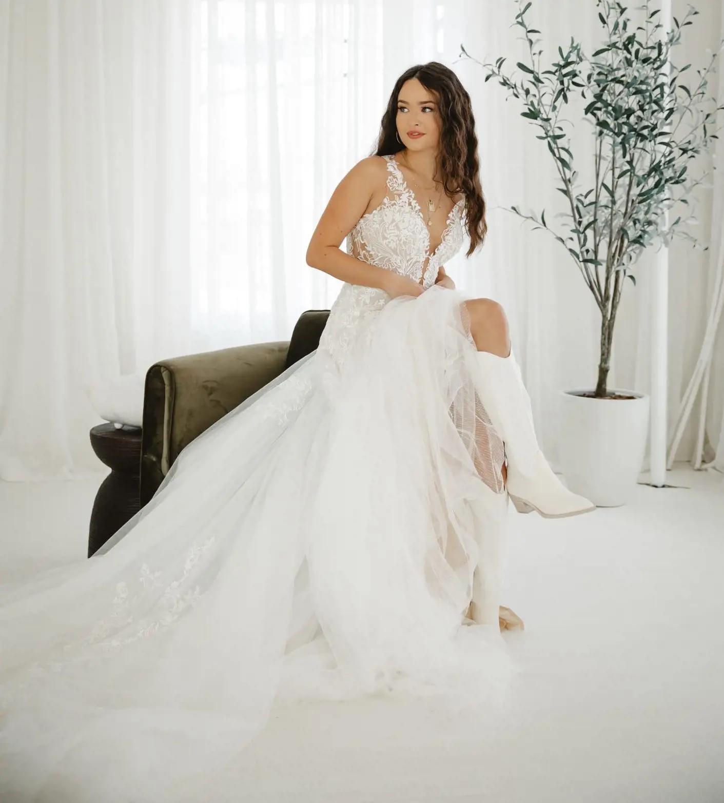 Model wearing a white rustic glam bridal gown