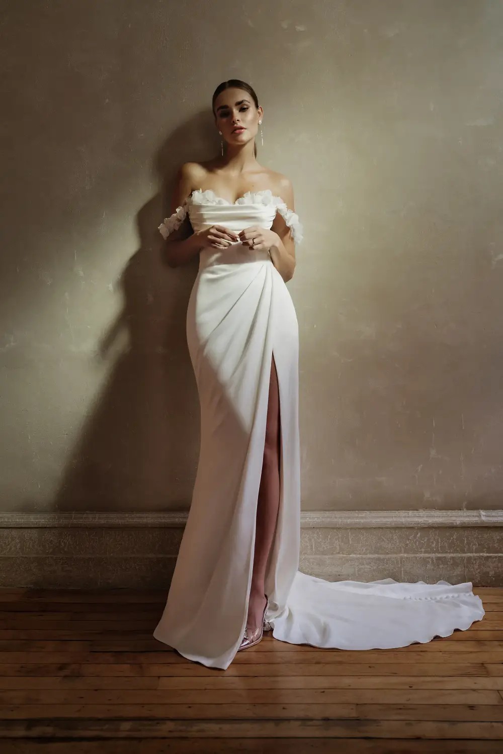 Model wearing a white simple bridal gown
