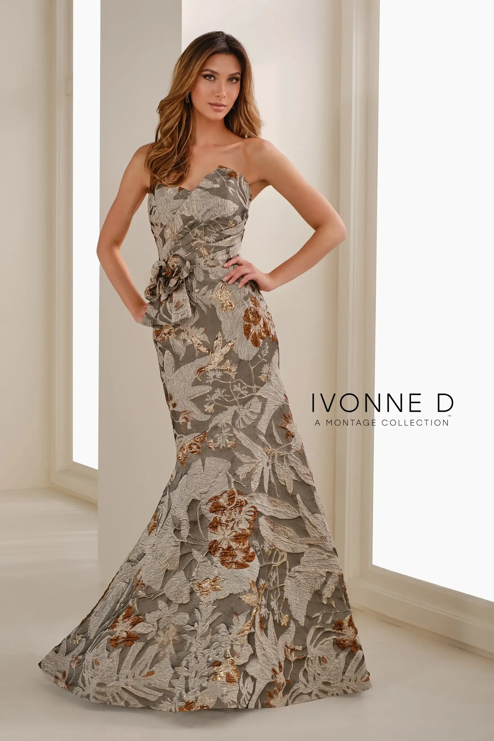 model is wearing a taupe strapless mothers dress