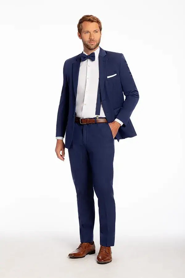 Model is wearing an indigo two-piece wool suit