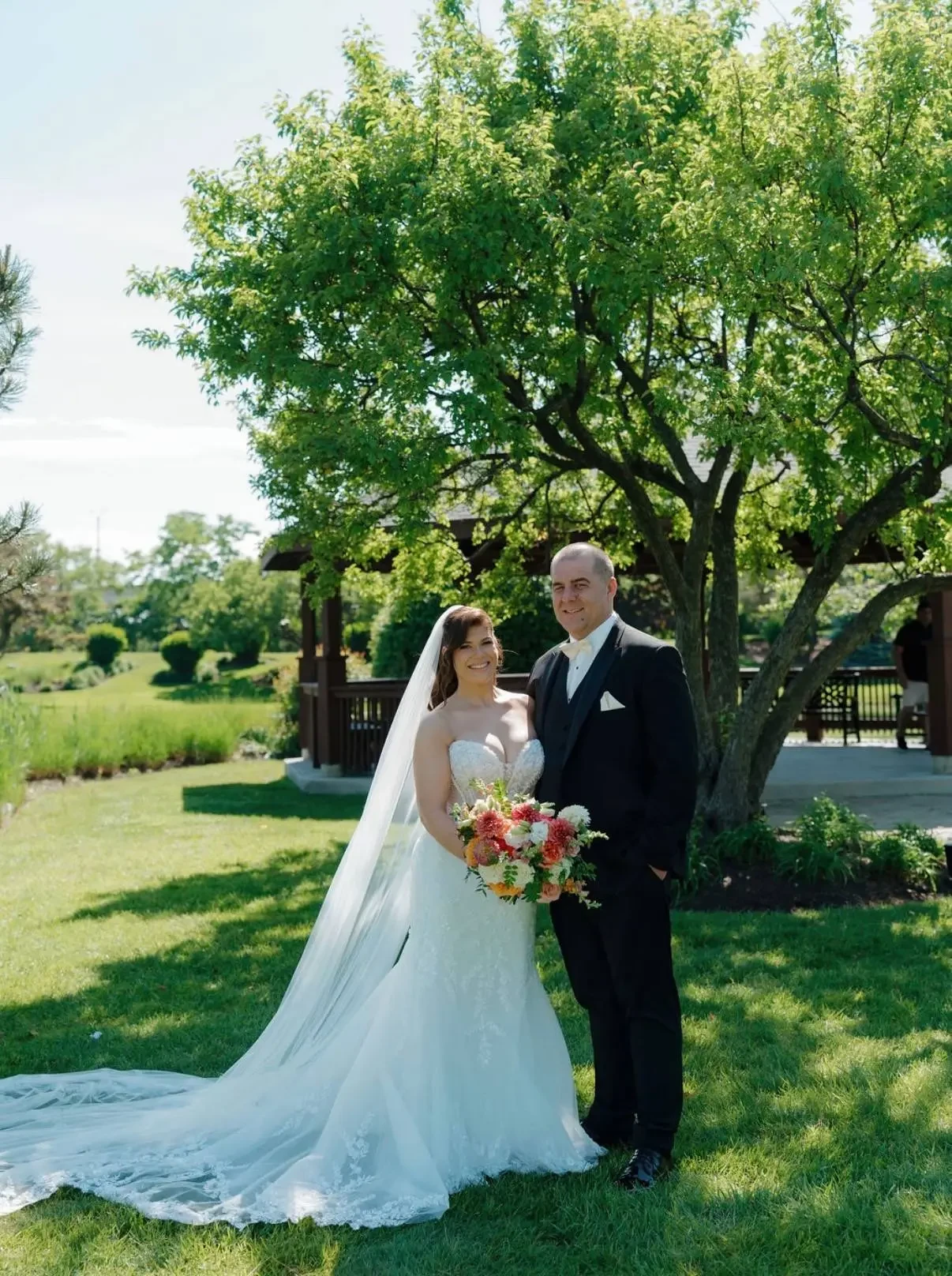 Real Volle's Bridal Bride standing next to groom