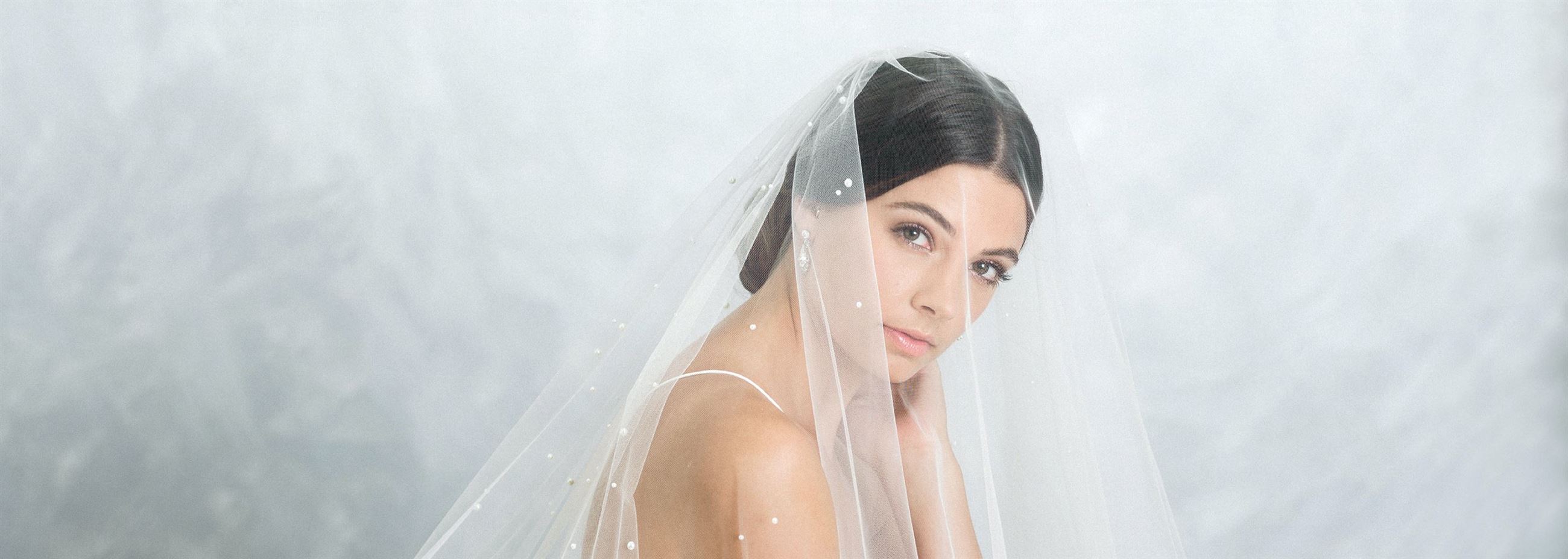 Model wearing a white gown