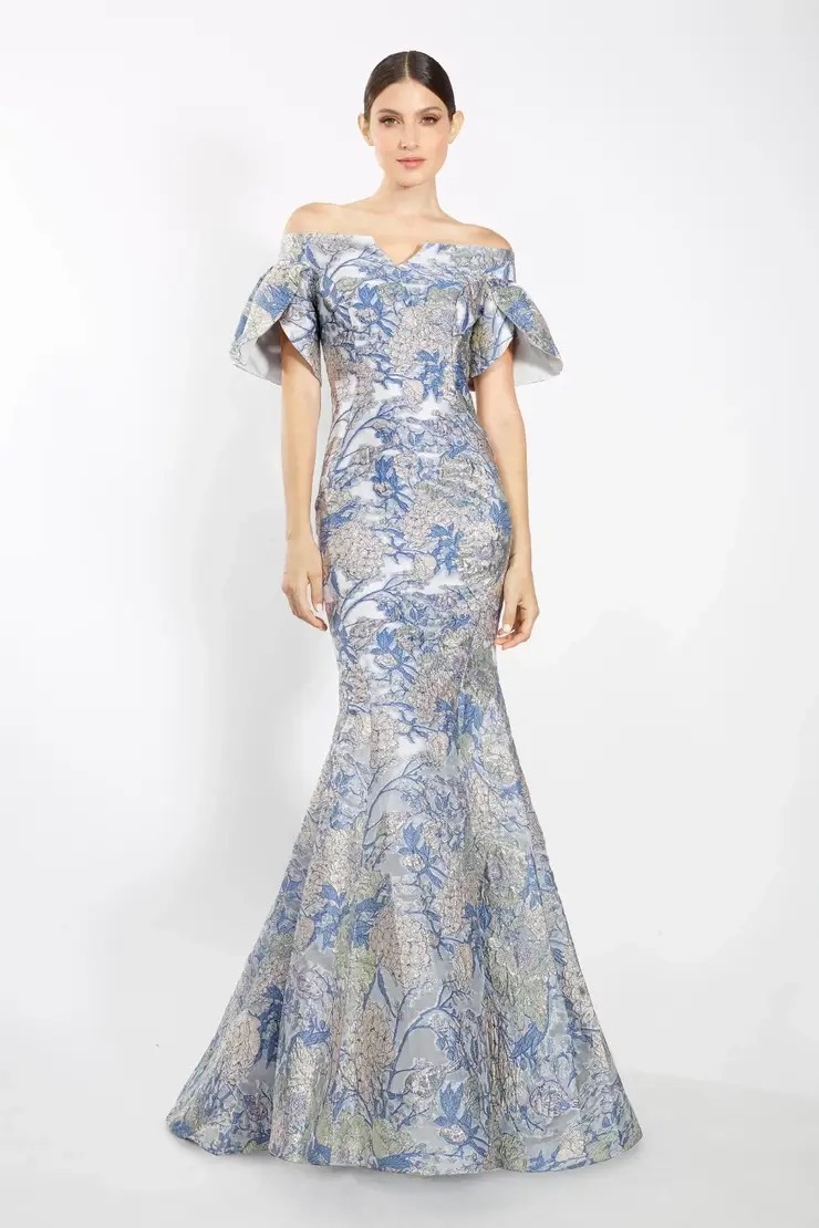 Model wearing blue print mother of the wedding gown by Janique