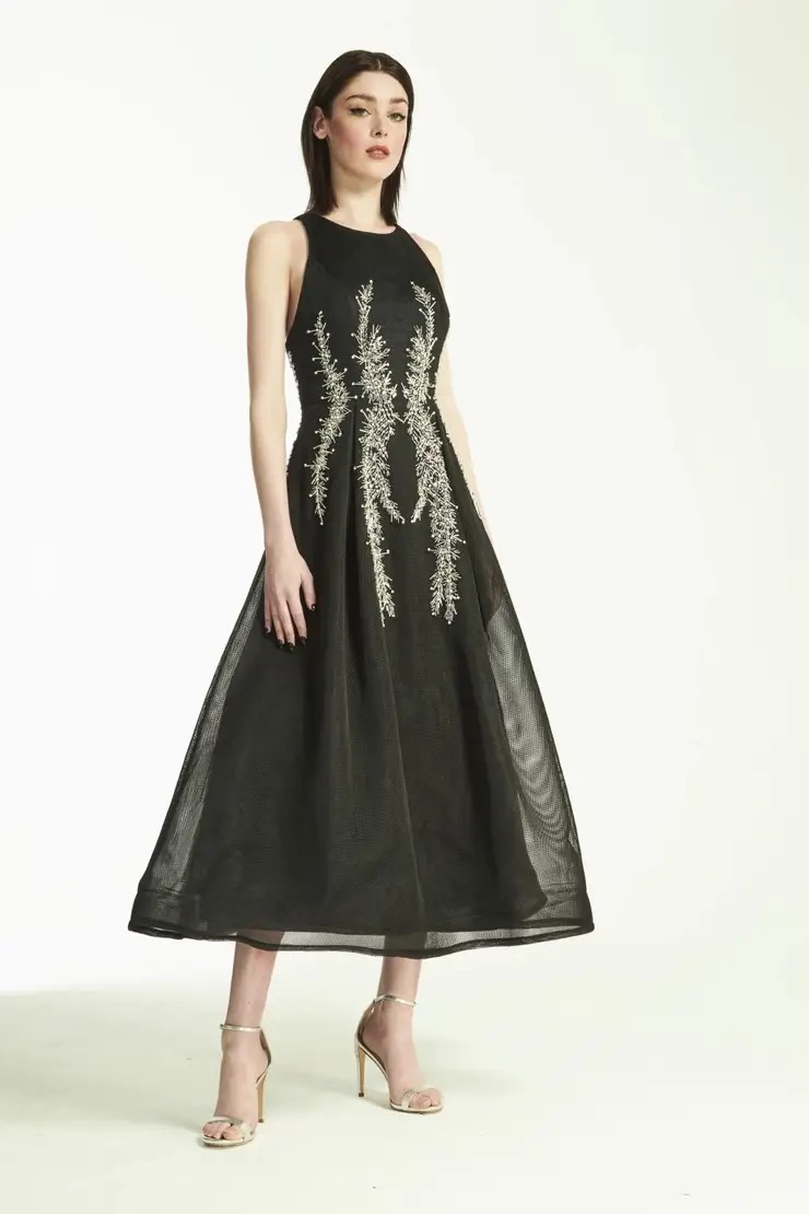 Model wearing short black Hynes Park gown