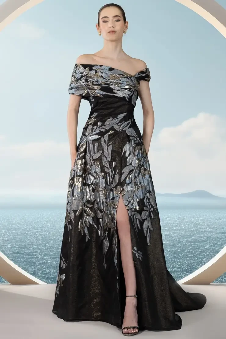 Model wearing blue print mother of the wedding gown by Janique