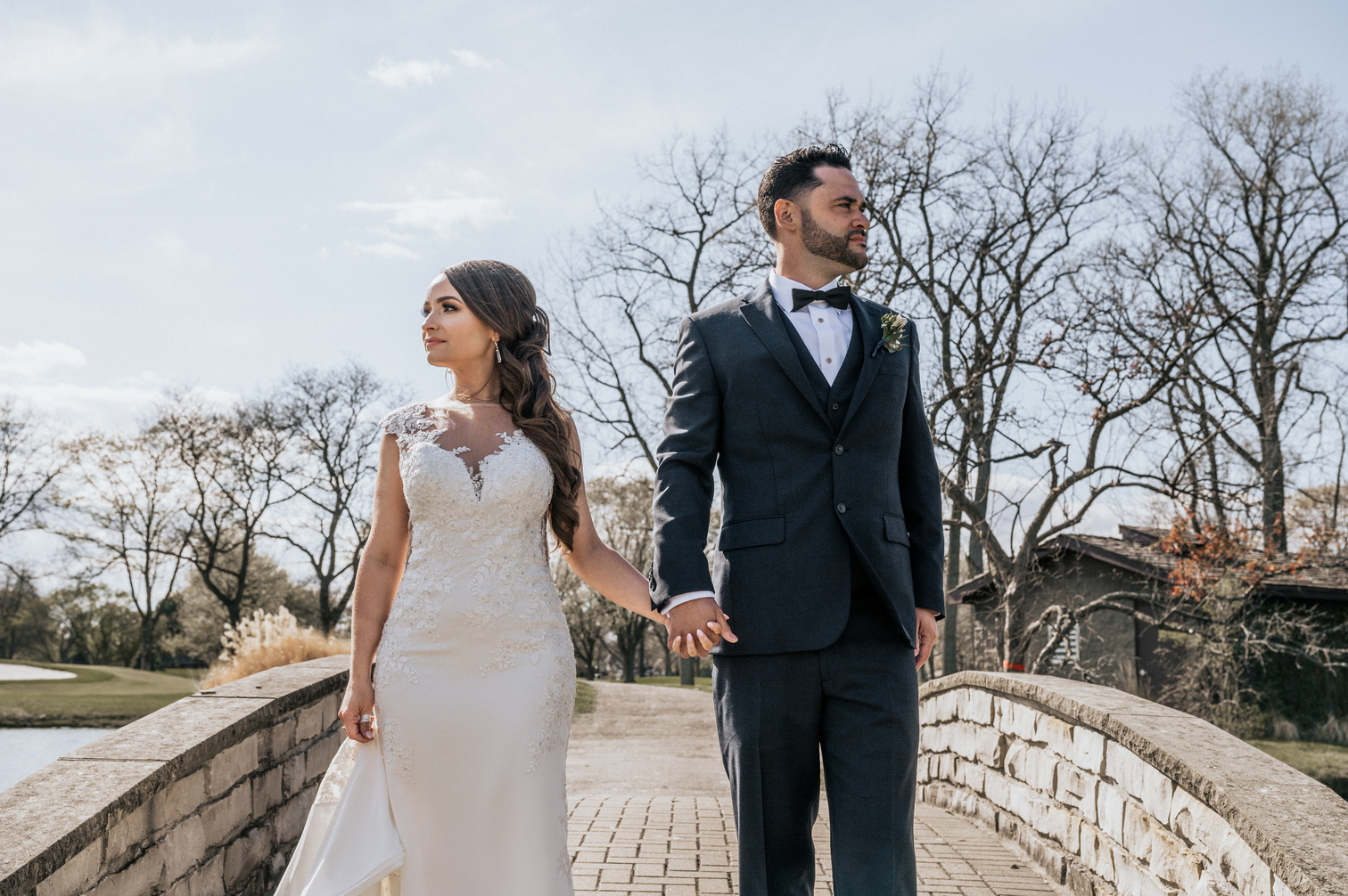 Сouple wearing a white gown and a black suit