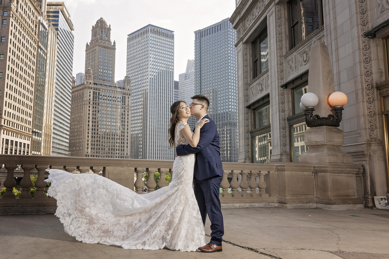 Сouple wearing a white gown and a dark-blue suit