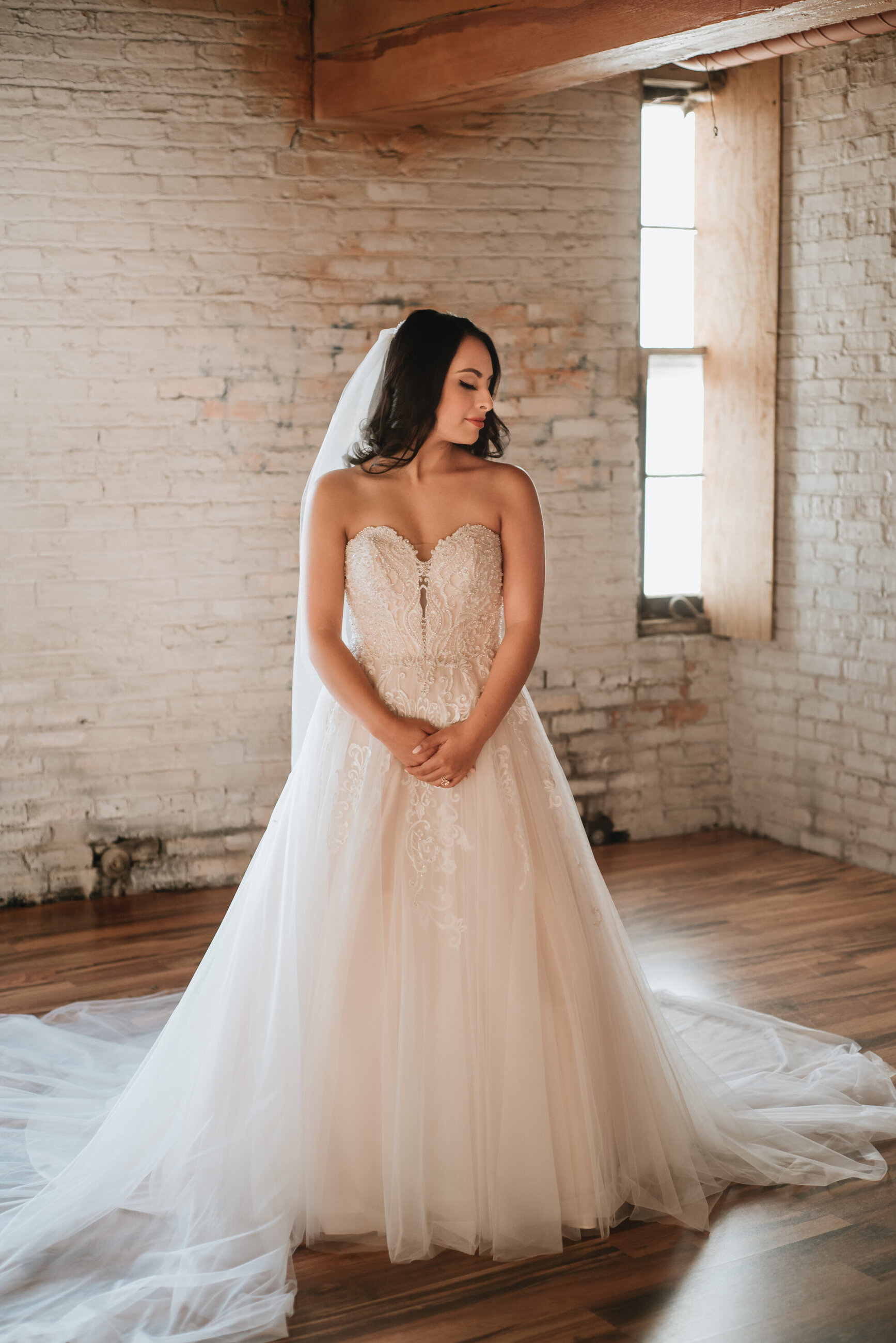 Model wearing a white gown at the house