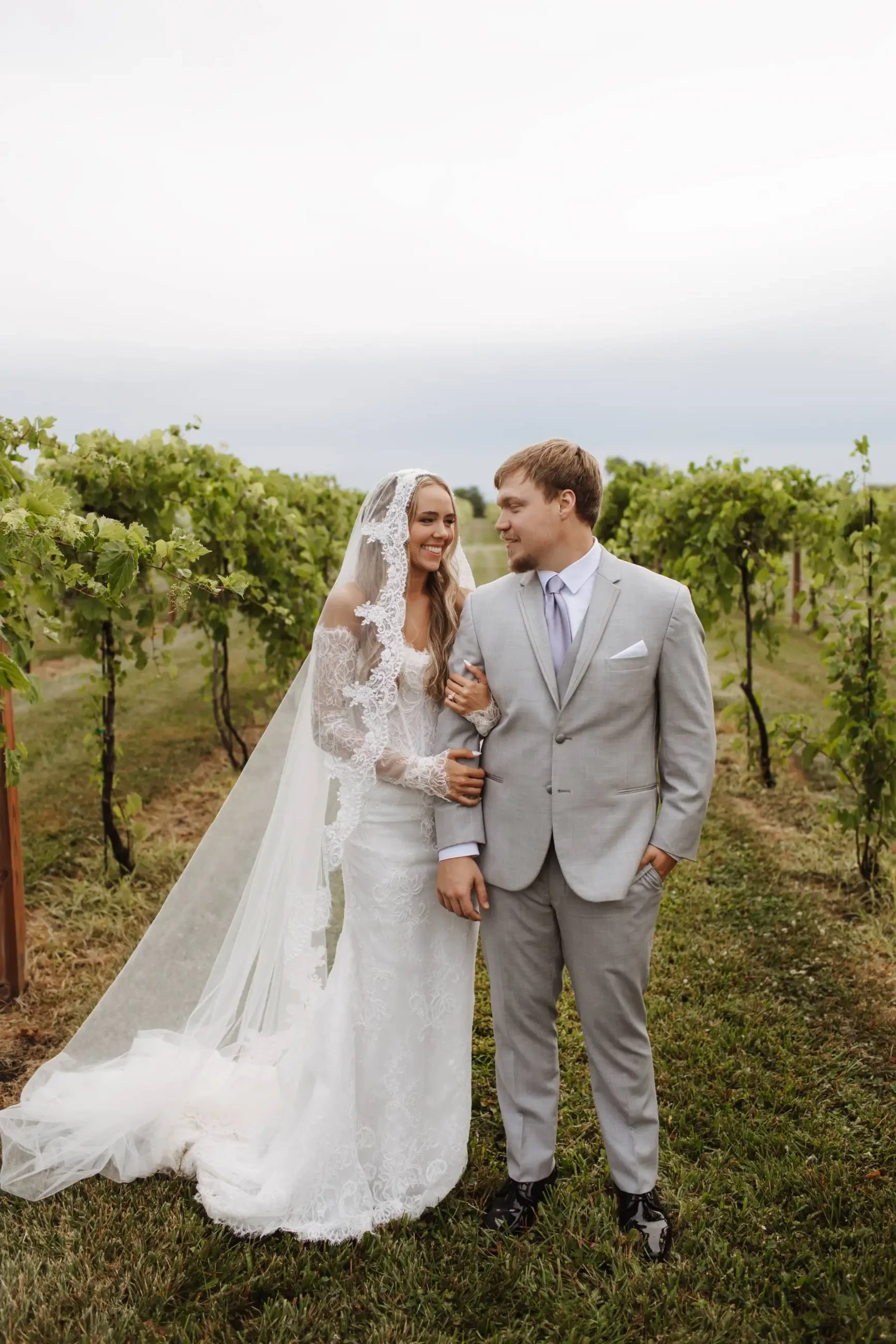 Real Volle's Bridal Bride standing next to groom