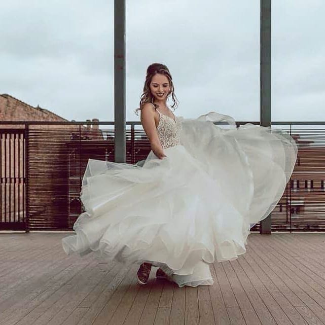 Model wearing a white gown